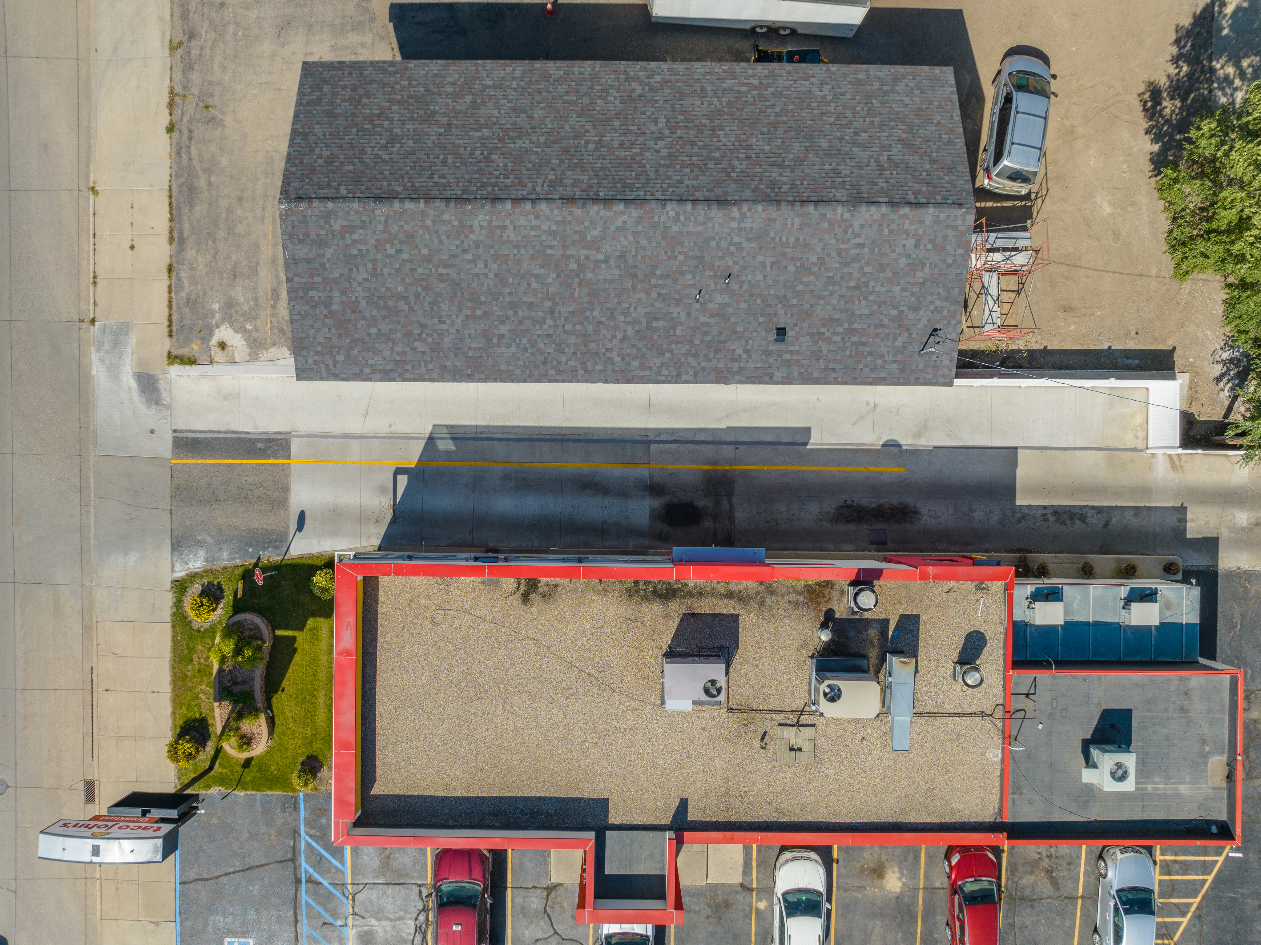 Top-down aerial of concrete drive lane with visible joint lines