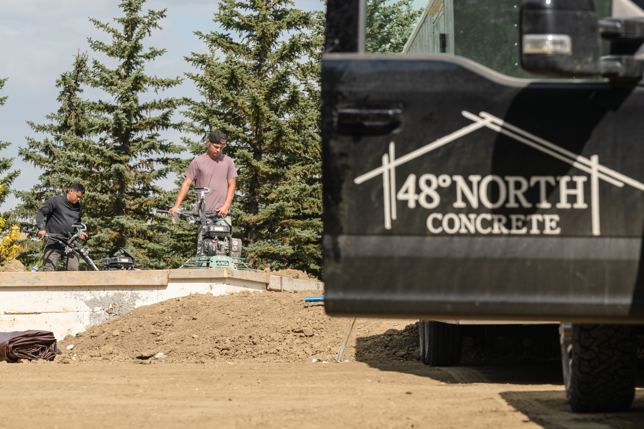 48 North Concrete truck logo with workers in background