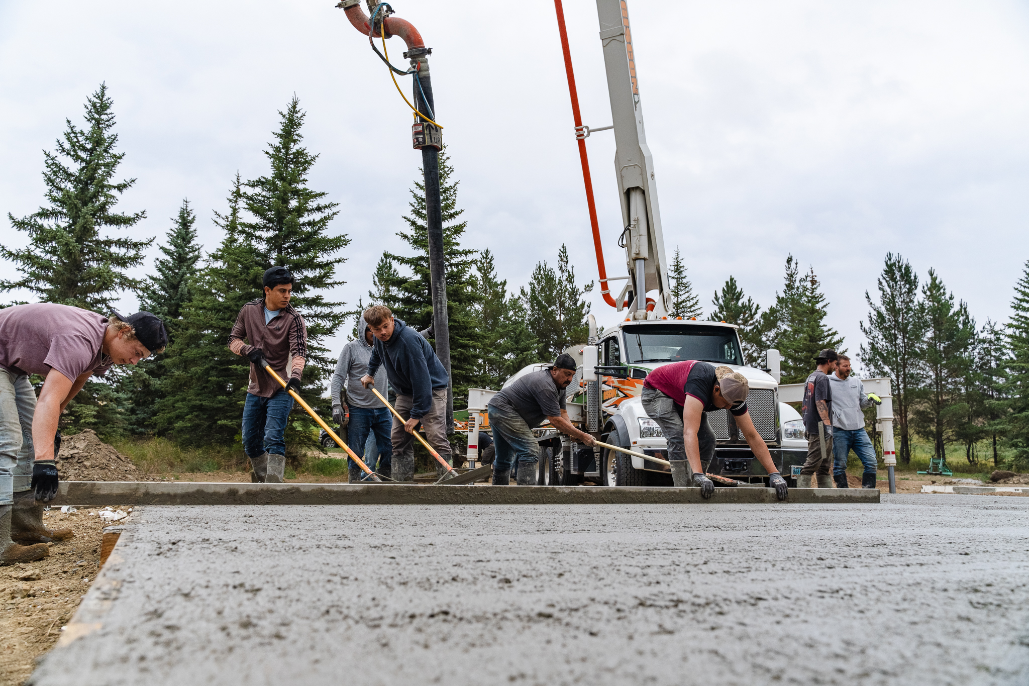 Full crew finishing a large commercial slab
